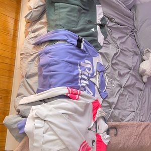 three pink half zips